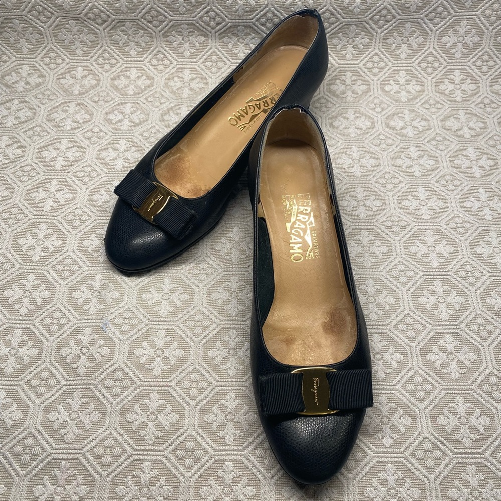 Salvatore Ferragamo pumps with gold-tone and bows